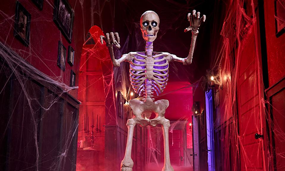 A skeleton with lights in a menacing pose.